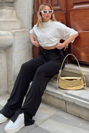 Black Women's Sweatpants with Elastic Waist and Slit Legs - Swist