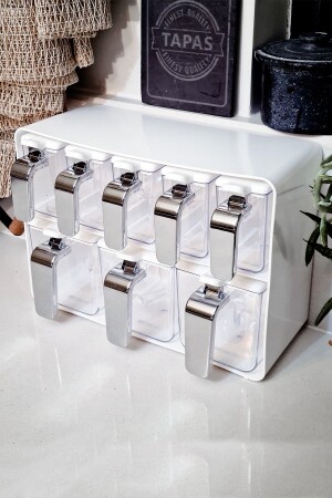 Eight-Piece Spice Jar Set with Chrome Handle and White Cover – 161280-818 1033376. 0012 - Herevin